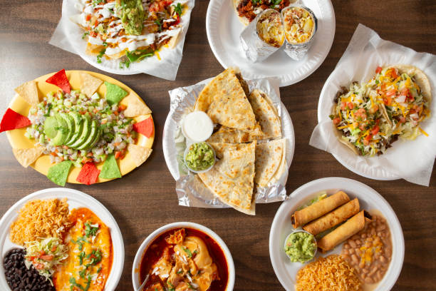 A top down view of several Mexican entrees.